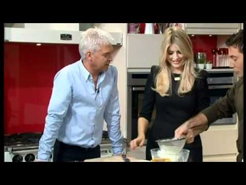 Holly and Phil laugh at Ginos sausage in the hole This Morning 14th October