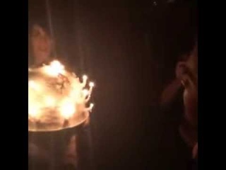 Adam Lambert blowing out candles on his birthday cake BDay party 2014